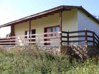 TWO HOUSES ON A COMMON PLOT Kavarna