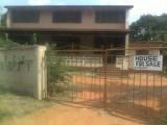 A 0.28 acre plot with house on. Accra